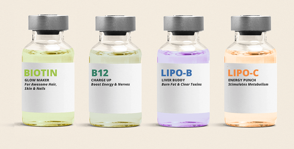 Four small vials with labels for different wellness injections: Biotin for 'Glow Maker,' B12 for 'Charge Up' and 'Boost Energy & Nerves,' Lipo-B for 'Liver Buddy' and 'Burn Fat & Clear Toxins,' and Lipo-C for 'Energy Punch' and 'Stimulates Metabolism.